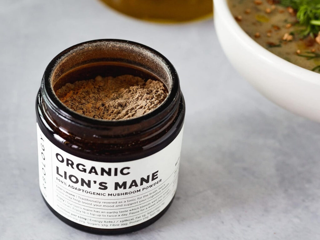 Open jar of Erbology Organic Lion’s Mane adaptogenic mushroom powder, a natural nootropic to support brain health and focus in perimenopause.